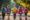 Kids holding hands walking home from school