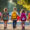 Kids holding hands walking home from school