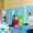 Young students energetically raising their hands in class